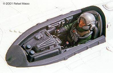 A detailed model of a pilot in the cockpit of a plane.